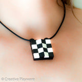 TESSELLATIONS Escher-inspired pendant made with LEGO® elements