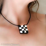Escher-inspired pendant made with LEGO® elements