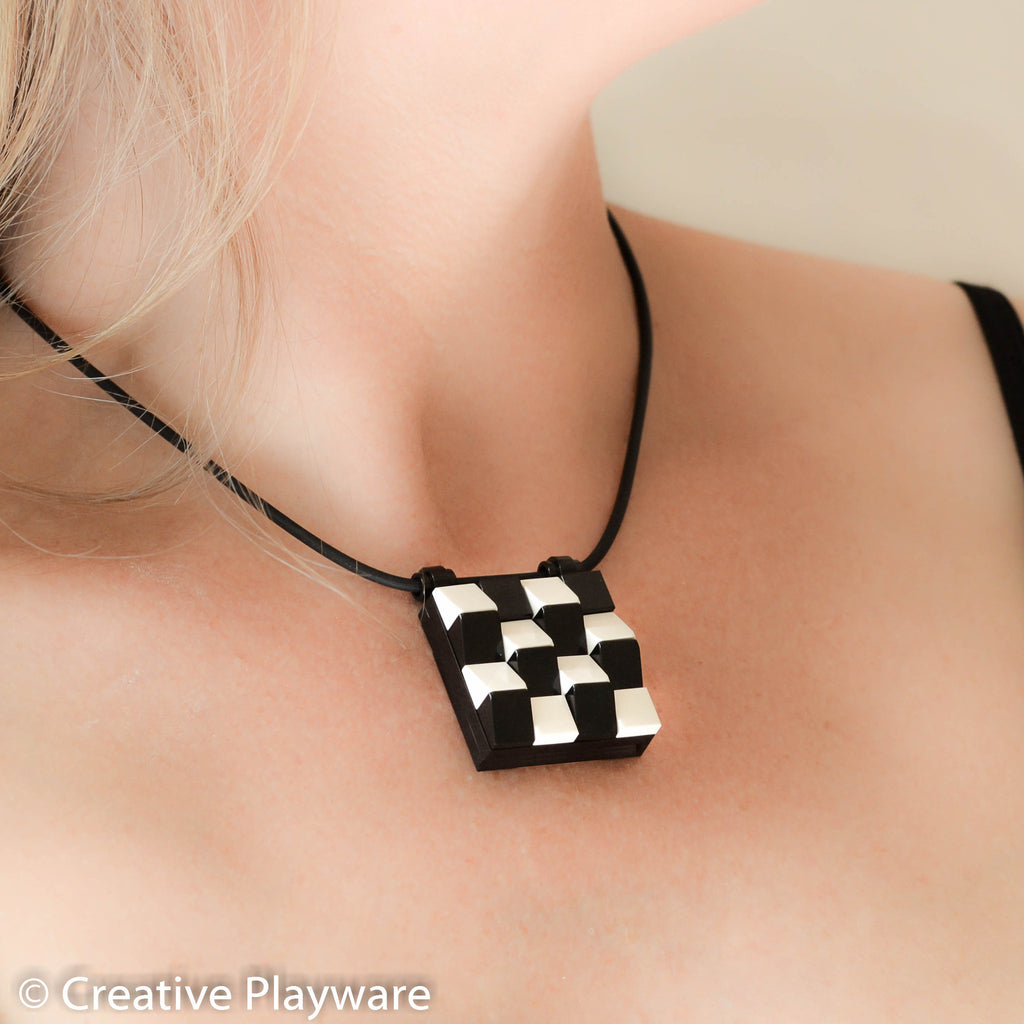 TESSELLATIONS Escher-inspired pendant made with LEGO® elements