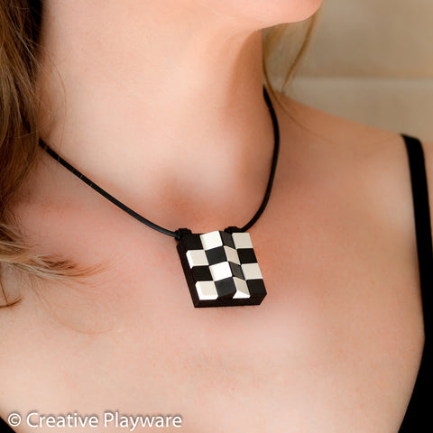 Escher-inspired pendant made with LEGO® elements